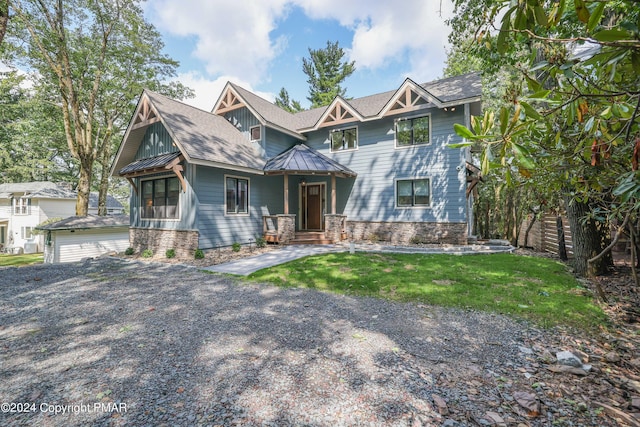 view of front of property featuring fence, roof with shingles, a front yard, a standing seam roof, and metal roof