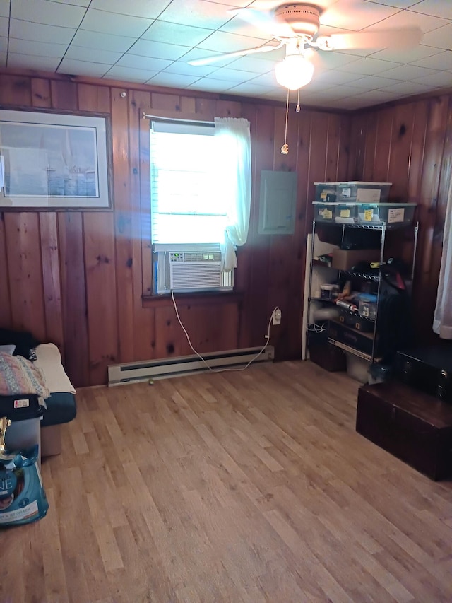 618 Mccabe Ln, Saylorsburg, PA 18353 - office featuring light wood-type flooring, a baseboard heating unit, ceiling fan, cooling unit, and wood walls