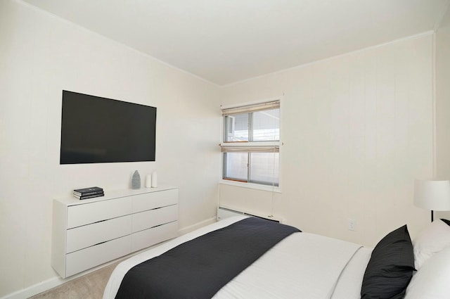 bedroom featuring a baseboard radiator and baseboards