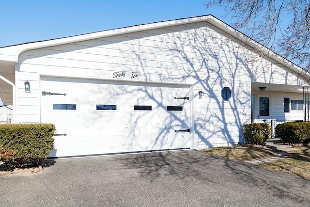 garage featuring driveway