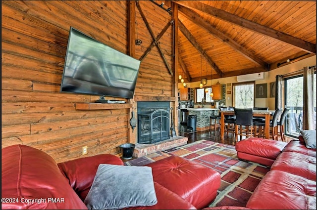 living room with a brick fireplace, wood ceiling, an AC wall unit, high vaulted ceiling, and beamed ceiling