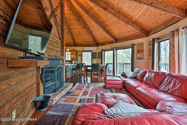 living room with a fireplace with raised hearth, high vaulted ceiling, wood finished floors, wood ceiling, and beam ceiling