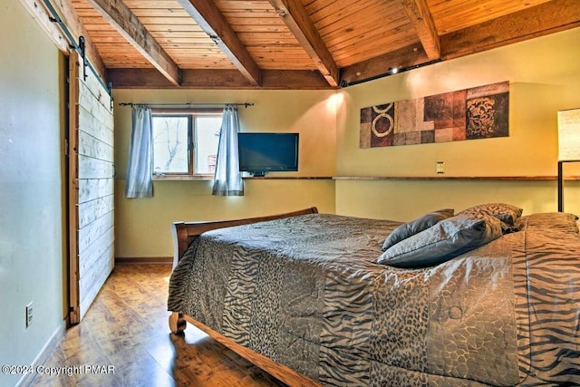 bedroom featuring a barn door, wood finished floors, wood ceiling, baseboards, and beam ceiling