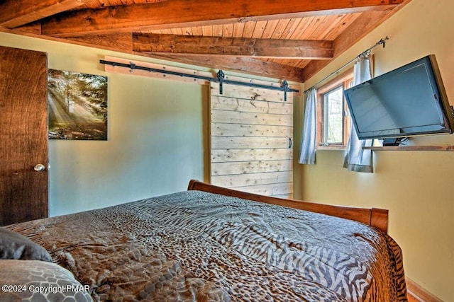 bedroom featuring wood ceiling, vaulted ceiling with beams, and a barn door