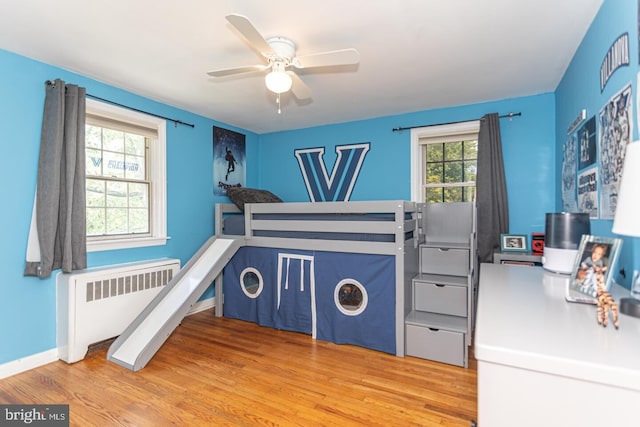 104 Lowrys Ln, Bryn Mawr, PA 19010 - bedroom featuring radiator heating unit, wood finished floors, and ceiling fan