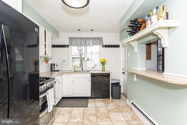 104 Lowrys Ln, Bryn Mawr, PA 19010 - kitchen with black appliances, white cabinetry, baseboard heating, and tasteful backsplash