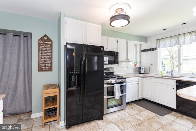 104 Lowrys Ln, Bryn Mawr, PA 19010 - kitchen featuring black appliances, white cabinets, decorative backsplash, and light stone counters