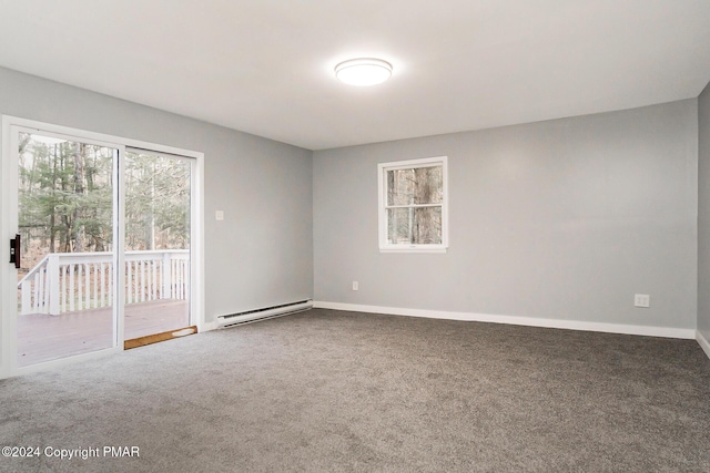 spare room featuring plenty of natural light, carpet floors, a baseboard radiator, and baseboards