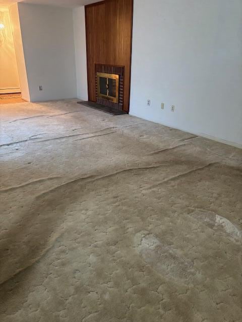 unfurnished living room with a fireplace