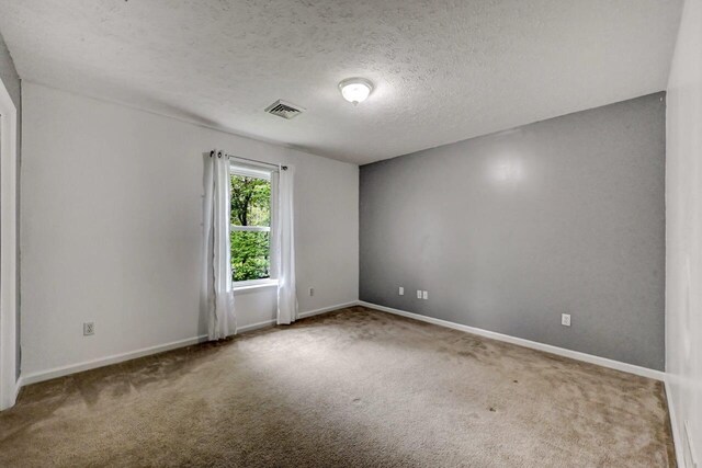 1162 Colt Ln, Pocono Summit, PA 18346 - carpeted empty room featuring baseboards and a textured ceiling