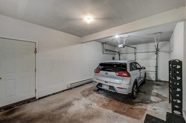 1162 Colt Ln, Pocono Summit, PA 18346 - garage with a garage door opener and baseboard heating