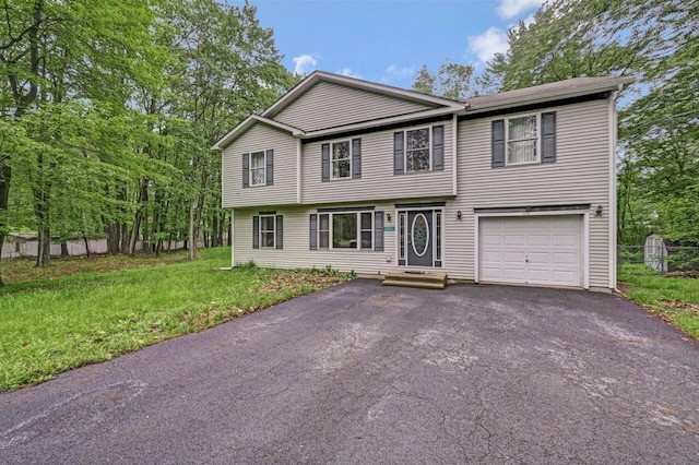 1162 Colt Ln, Pocono Summit, PA 18346 - view of front of property with asphalt driveway, a garage, and a front yard