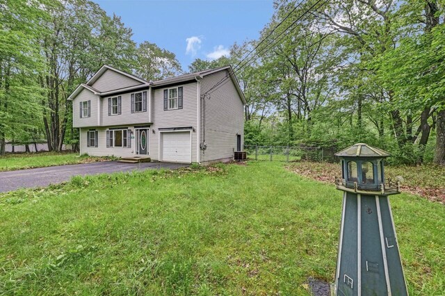 1162 Colt Ln, Pocono Summit, PA 18346 - view of front facade with asphalt driveway and an attached garage