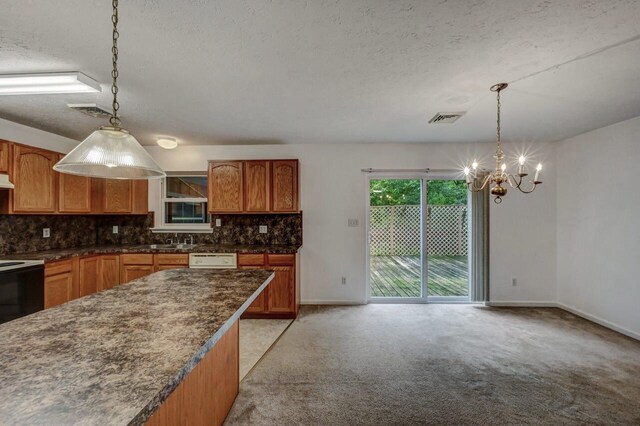 1162 Colt Ln, Pocono Summit, PA 18346 - kitchen featuring a chandelier, decorative backsplash, light colored carpet, a textured ceiling, and decorative light fixtures