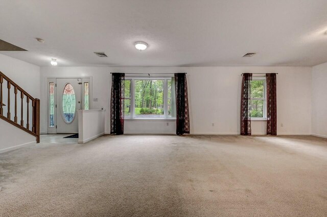 1162 Colt Ln, Pocono Summit, PA 18346 - spare room featuring light colored carpet and stairway