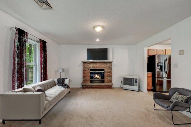 1162 Colt Ln, Pocono Summit, PA 18346 - living room featuring light carpet, a fireplace, and heating unit