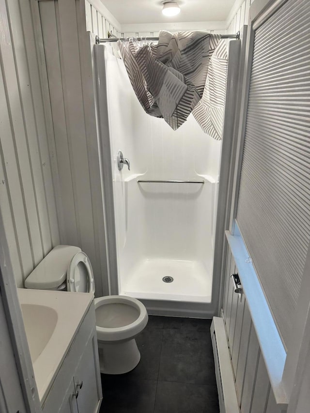 4932 Pine Ridge Dr W, Bushkill, PA 18324 - bathroom featuring vanity, a shower stall, tile patterned flooring, and a baseboard radiator