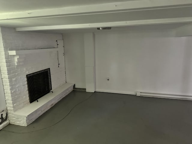 4932 Pine Ridge Dr W, Bushkill, PA 18324 - below grade area featuring a brick fireplace and a baseboard heating unit
