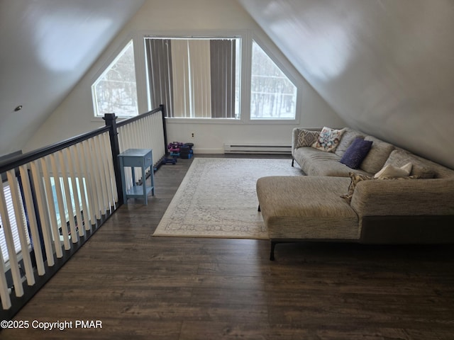 bonus room with vaulted ceiling, baseboard heating, and wood finished floors