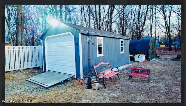 detached garage with fence