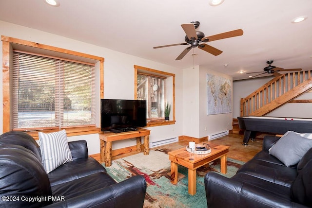 living room featuring recessed lighting, a ceiling fan, baseboards, stairs, and baseboard heating