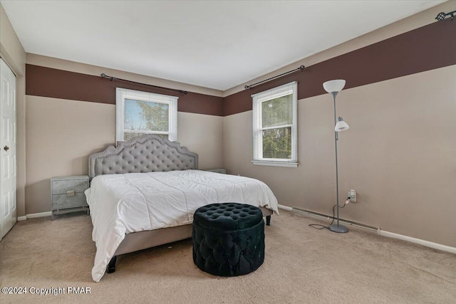 bedroom with carpet floors and baseboards