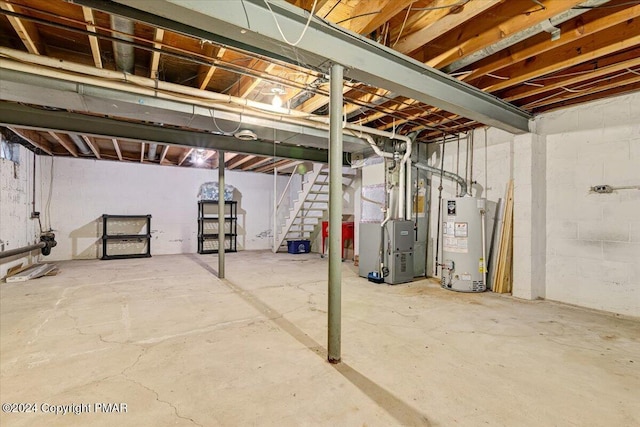 unfinished below grade area featuring water heater, heating unit, and stairs