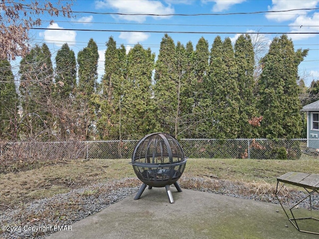 view of patio / terrace with an outdoor fire pit and a fenced backyard