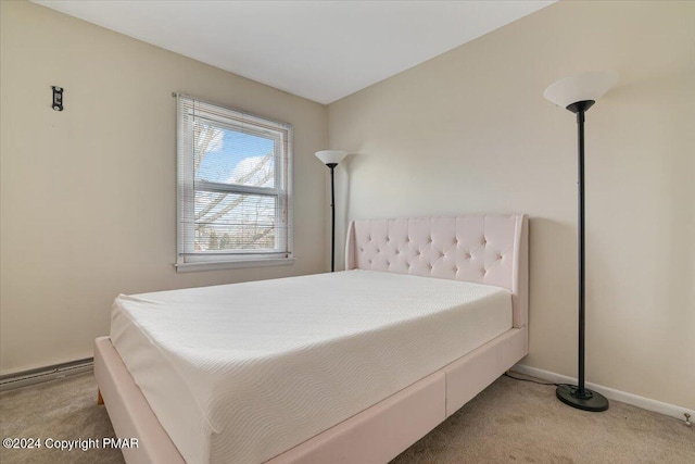 carpeted bedroom with baseboards