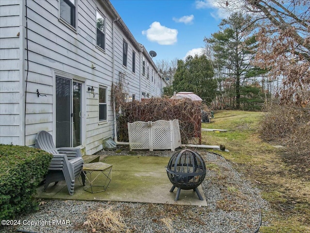 view of yard with a patio area and an outdoor fire pit