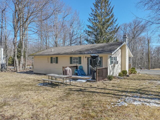 9148 Brandywine Dr, Tobyhanna, PA 18466 - rear view of property with a chimney, a lawn, a wooden deck, and cooling unit