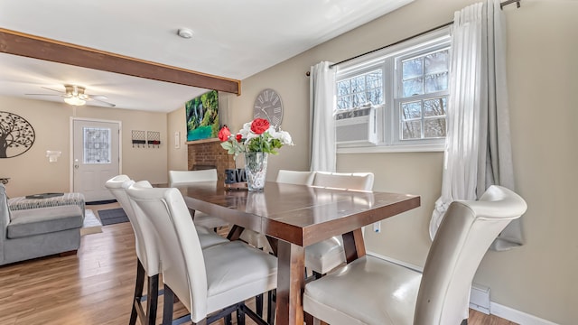 9148 Brandywine Dr, Tobyhanna, PA 18466 - dining area with light wood-style flooring, a ceiling fan, beam ceiling, and baseboards