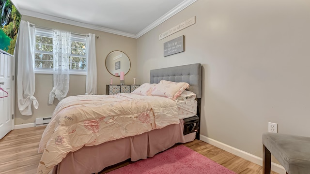 9148 Brandywine Dr, Tobyhanna, PA 18466 - bedroom with a baseboard heating unit, crown molding, baseboards, and wood finished floors