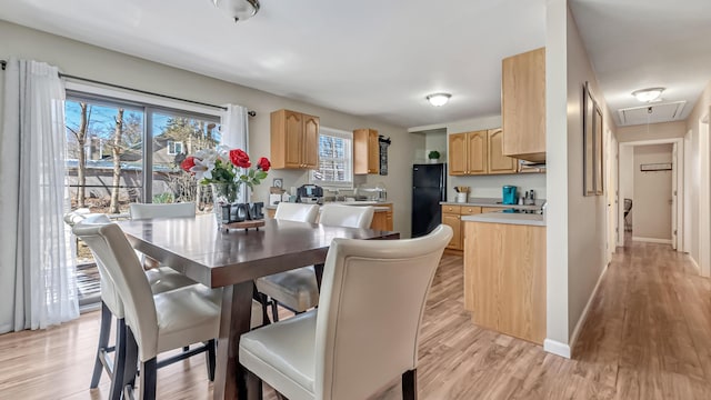 9148 Brandywine Dr, Tobyhanna, PA 18466 - dining room featuring attic access, light wood-style floors, and baseboards