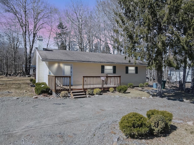9148 Brandywine Dr, Tobyhanna, PA 18466 - view of front of house with a chimney and a wooden deck