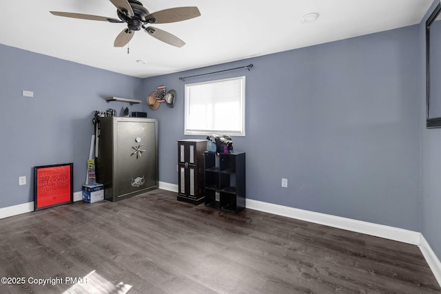 miscellaneous room with ceiling fan, baseboards, and wood finished floors