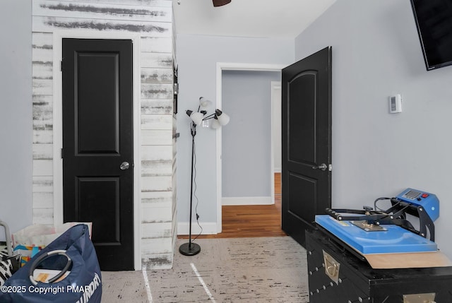 bathroom with baseboards and wood finished floors