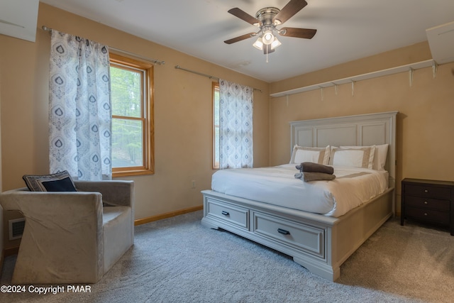 bedroom featuring baseboards, visible vents, ceiling fan, and carpet flooring