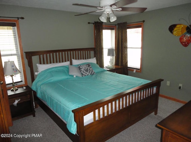 bedroom featuring ceiling fan, carpet flooring, and baseboards