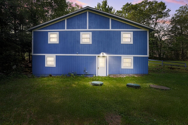 3119 Essex Rd, Coolbaugh Township, PA 18466 - rear view of property featuring a yard
