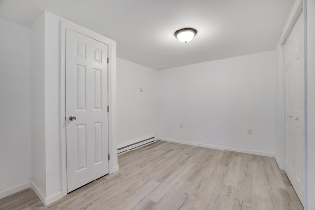 3119 Essex Rd, Coolbaugh Township, PA 18466 - spare room featuring a baseboard heating unit and light wood finished floors