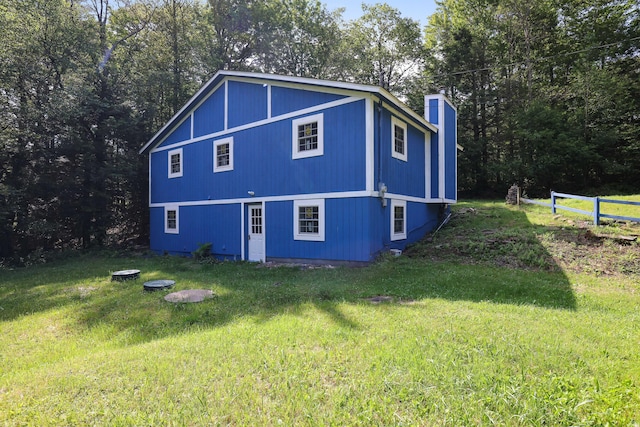 3119 Essex Rd, Coolbaugh Township, PA 18466 - view of side of home with a chimney and a yard