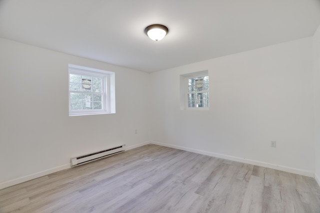 3119 Essex Rd, Coolbaugh Township, PA 18466 - empty room with baseboard heating, plenty of natural light, and light wood finished floors