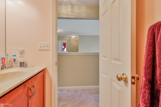bathroom featuring vanity and baseboards