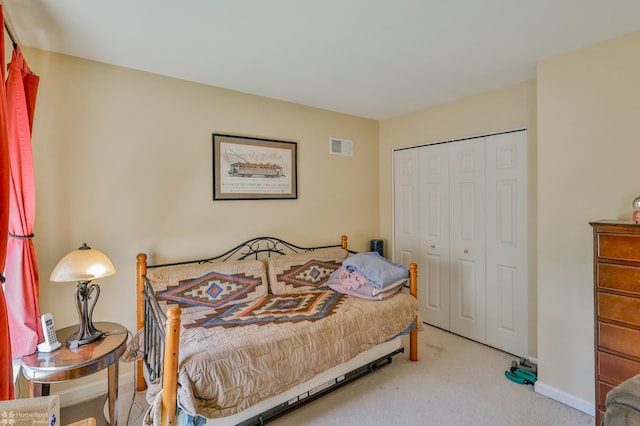 bedroom featuring carpet floors, a closet, and baseboards