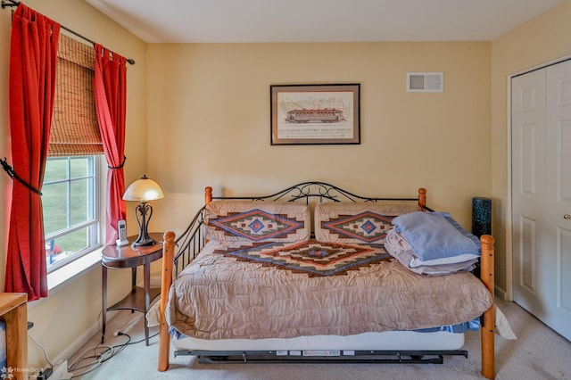 bedroom featuring carpet flooring and baseboards