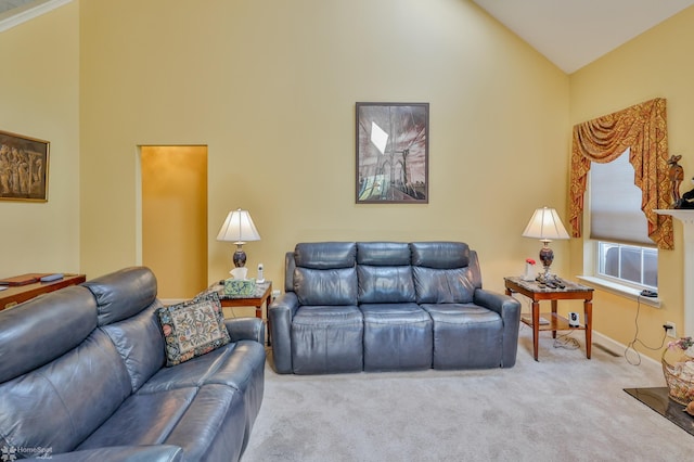 living room with high vaulted ceiling, carpet floors, and baseboards