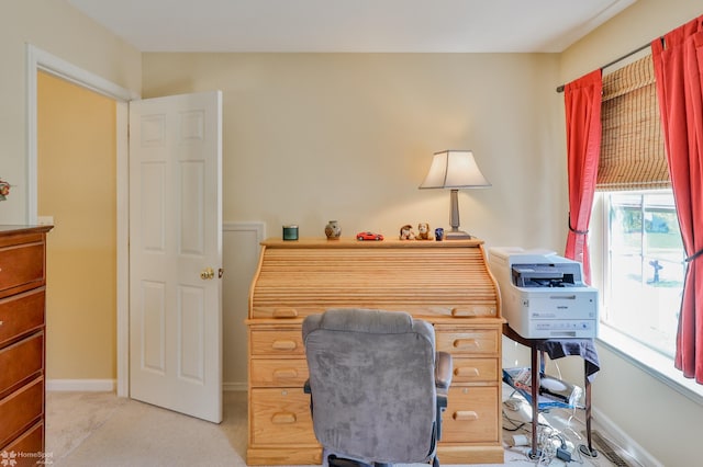 office area featuring light colored carpet and baseboards