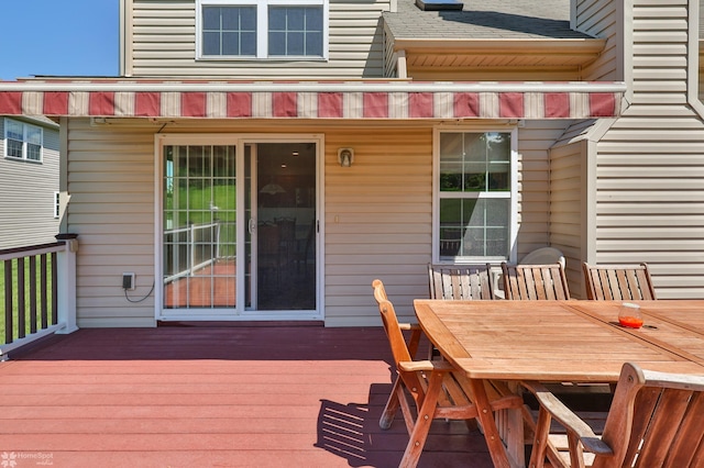 wooden deck with outdoor dining area