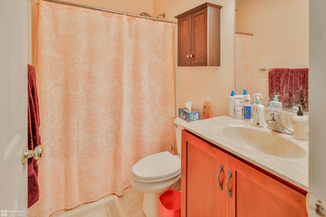 full bathroom featuring toilet and vanity